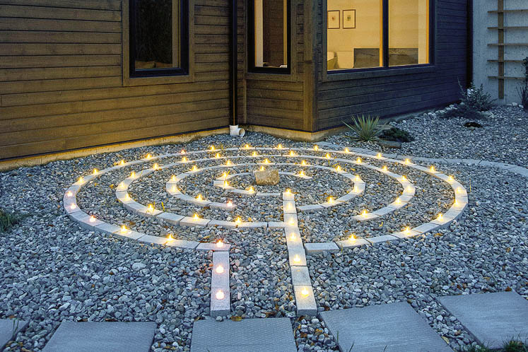 One of the labyrinths Jan and Ivana designed on the property is set among pebbles and lit. Another is mown into a nearby meadow.