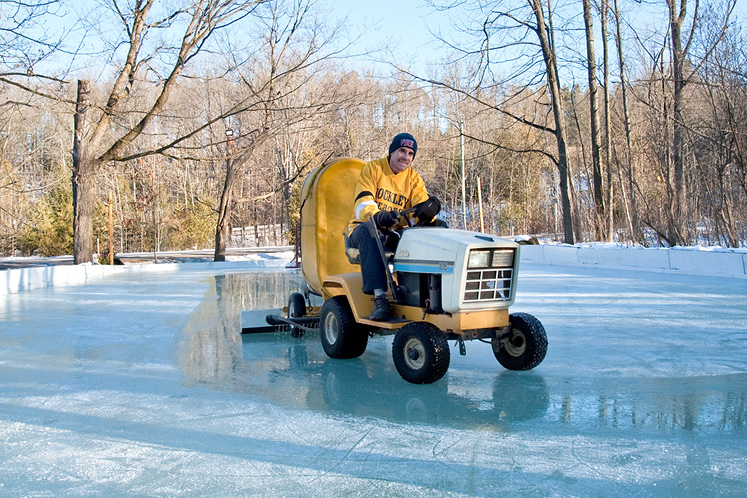 Tom Darlow astride his “Zamboni” – a contraption of his own design – on his outdoor ice rink in Hockley valley.