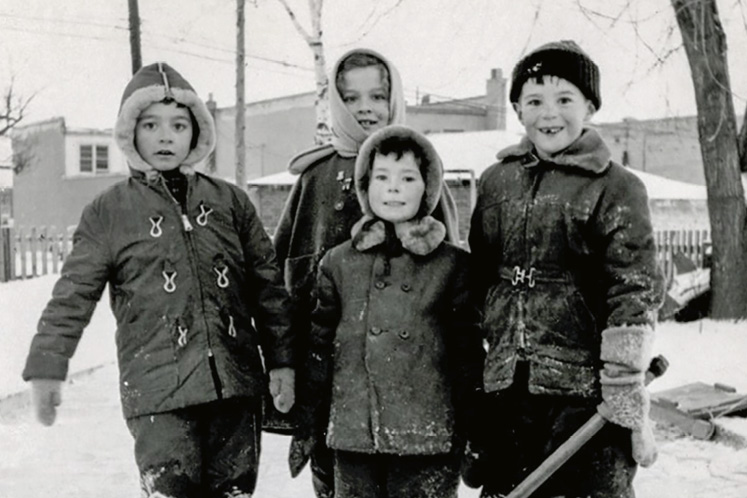 Writer Anthony Jenkins (far right) as an exuberant, gap-toothed youngster taking on the hockey world in the 1950s, with his sister and two neighbourhood friends in tow.